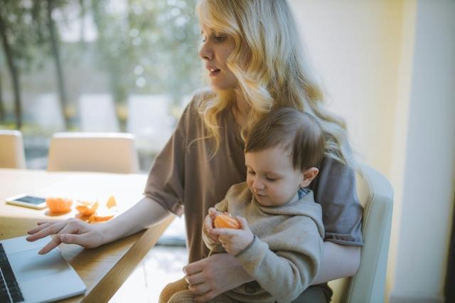 Photo by  Anastasia  Shuraeva: https://www.pexels.com/photo/photo-of-woman-carrying-her-baby-while-working-on-her-laptop-4079283/